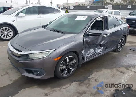 2016 Honda Civic Touring z USA, uszkodzony, nr VIN 19XFC1F95GE022641